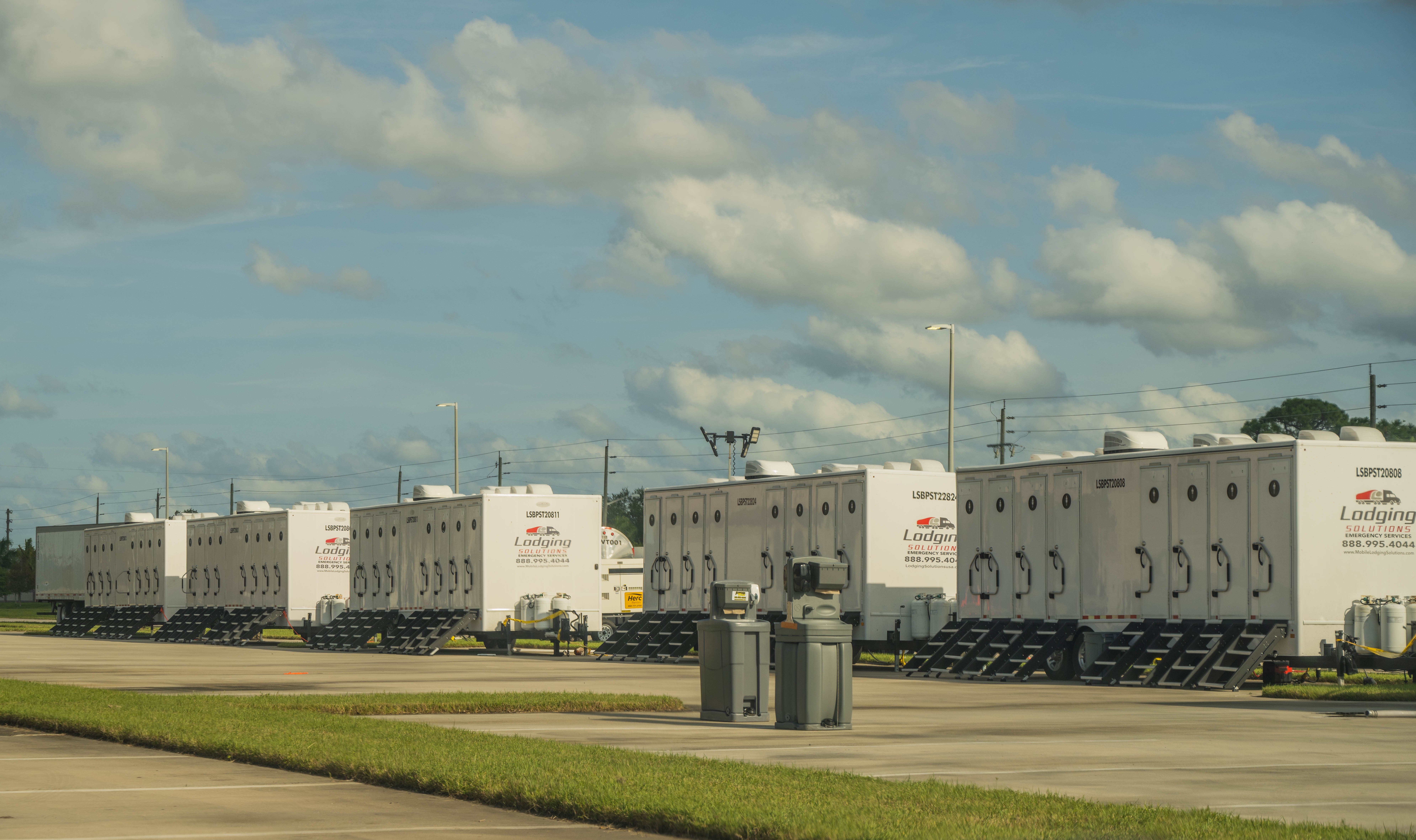 Lodging Solutions and Industrial Tents - Case Study Photo - Hurricane Ian Recovery Base Camp Melbourne FL Project - MOBILE RESTROOM TRAILERS PHOTO